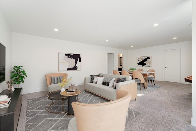 living room featuring recessed lighting, baseboards, and carpet