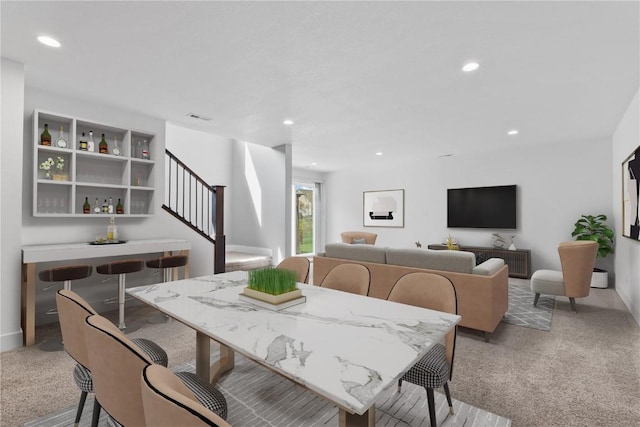 dining area with light colored carpet, recessed lighting, stairs, and visible vents