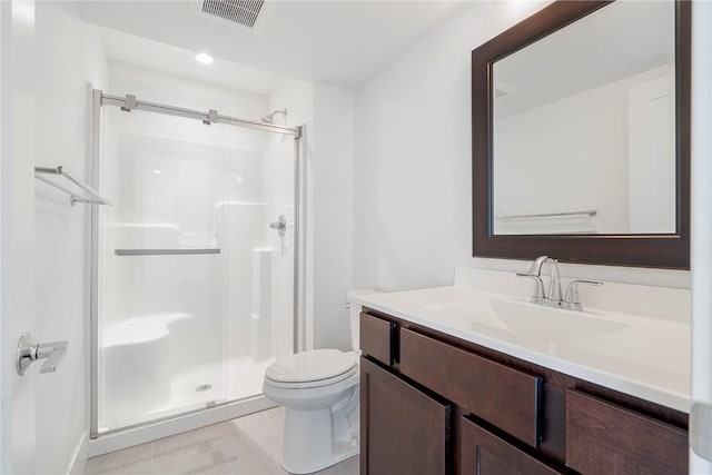full bath featuring visible vents, a stall shower, toilet, and vanity