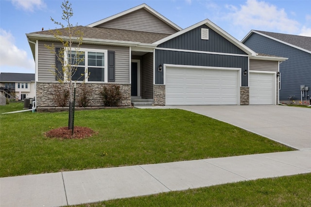 1330 Chipman Ln, North Liberty, IA 52317 - craftsman-style house with an attached garage, concrete driveway, and stone siding