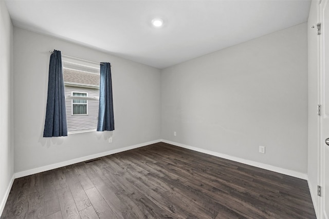 1330 Chipman Ln, North Liberty, IA 52317 - unfurnished room featuring dark wood-style flooring, baseboards, and visible vents