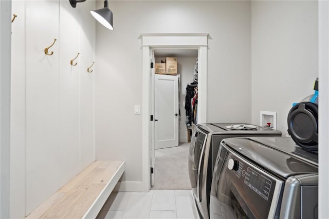 1405 Foxtail Dr, Fairfax, IA 52228 - clothes washing area with washing machine and dryer, cabinet space, and baseboards
