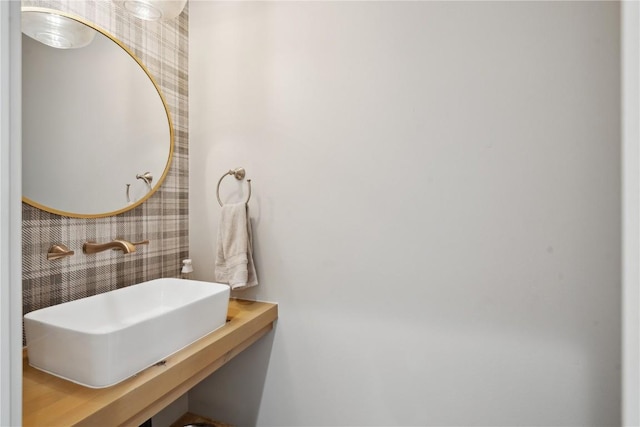 1405 Foxtail Dr, Fairfax, IA 52228 - bathroom featuring wallpapered walls and a sink
