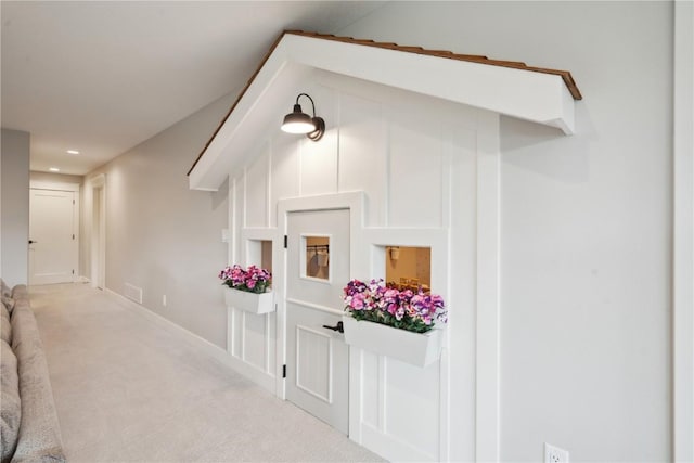 hallway with recessed lighting, carpet flooring, and baseboards