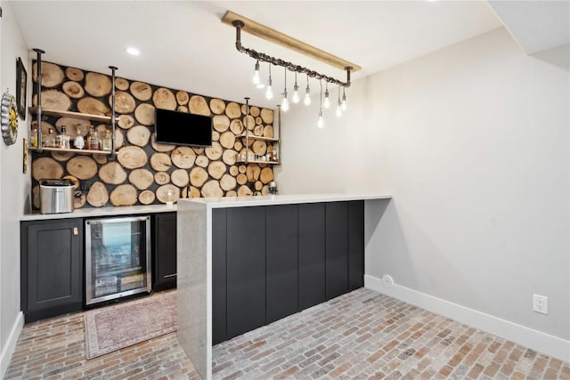 bar featuring indoor bar, baseboards, brick floor, and wine cooler
