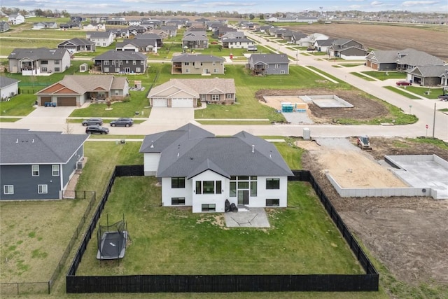 birds eye view of property with a residential view