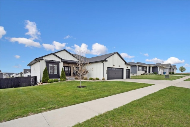 view of front of home featuring fence, an attached garage, board and batten siding, a front yard, and driveway