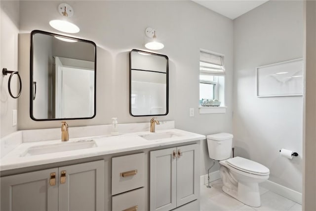 1405 Foxtail Dr, Fairfax, IA 52228 - full bath featuring baseboards, toilet, tile patterned flooring, and double vanity