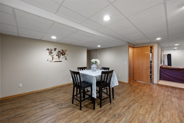 dining room with baseboards, recessed lighting, and wood finished floors