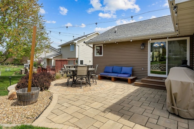 view of patio / terrace with fence, outdoor dining space, area for grilling, and outdoor lounge area