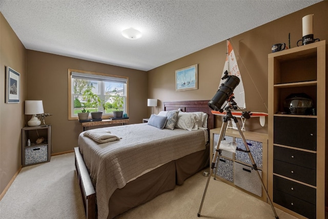 carpeted bedroom featuring a textured ceiling and baseboards