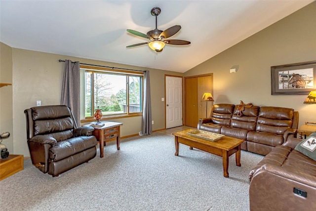 living room featuring ceiling fan, light carpet, baseboards, and lofted ceiling