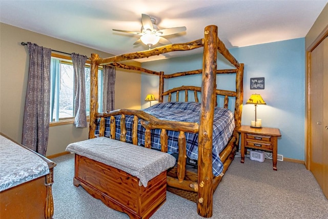 carpeted bedroom with baseboards and a ceiling fan