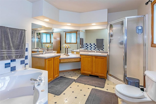 full bathroom with vanity, toilet, tile patterned floors, a shower stall, and a garden tub