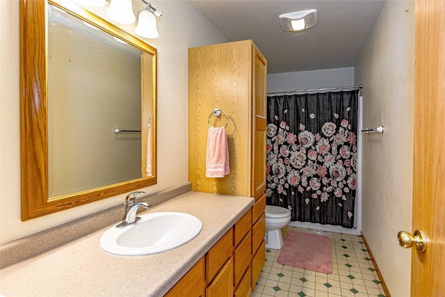 bathroom featuring tile patterned floors, vanity, toilet, and a shower with shower curtain