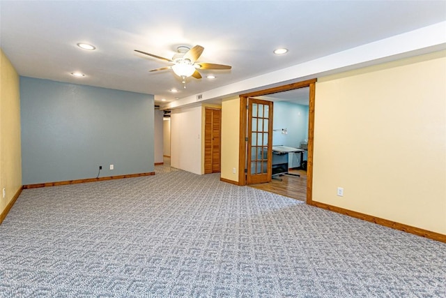 carpeted spare room featuring recessed lighting, baseboards, and ceiling fan