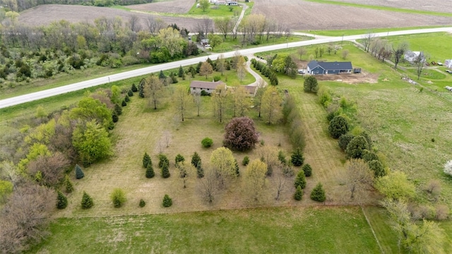 birds eye view of property featuring a rural view
