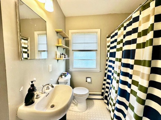 2105 Muscatine Ave, Iowa City, IA 52240 - full bath with a sink, toilet, tile patterned floors, a shower with curtain, and a baseboard heating unit