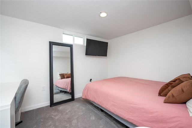 bedroom featuring carpet flooring and baseboards