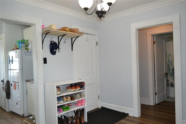 855 Center Pt NE, Cedar Rapids, IA 52402 - mudroom with ornamental molding, wood finished floors, and a chandelier