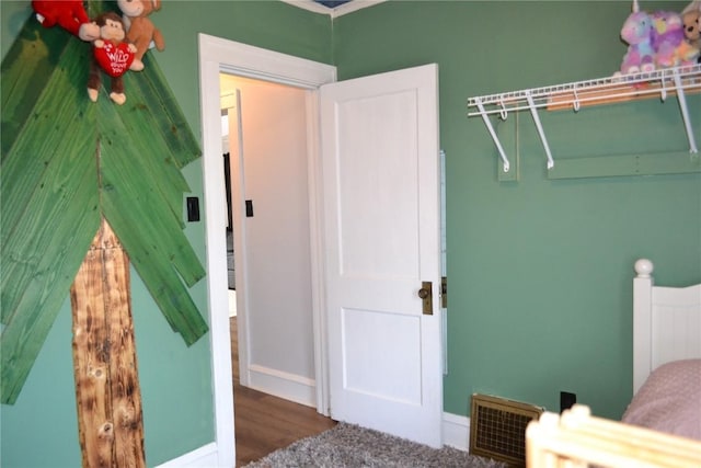 855 Center Pt NE, Cedar Rapids, IA 52402 - bedroom featuring wood finished floors and baseboards