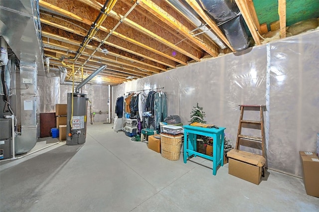 unfinished basement featuring heating unit and gas water heater