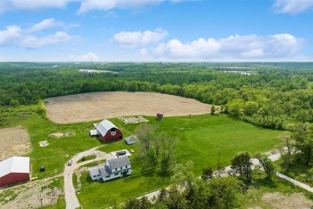 aerial view featuring a rural view and a wooded view