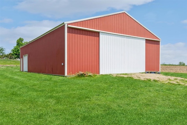 view of pole building with a lawn