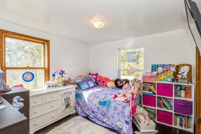 bedroom featuring multiple windows