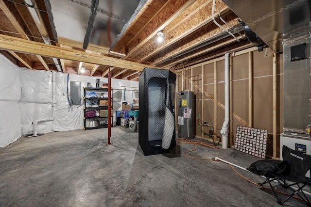 unfinished basement featuring water heater and electric panel