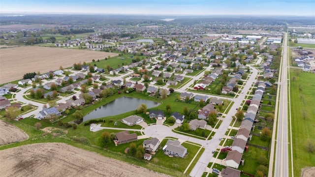 drone / aerial view with a water view and a residential view