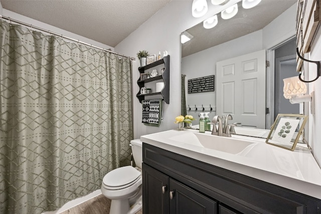 full bath featuring vanity, wood finished floors, toilet, a textured ceiling, and a shower with curtain