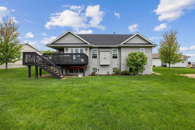 back of property with stairs, roof with shingles, a yard, and a deck