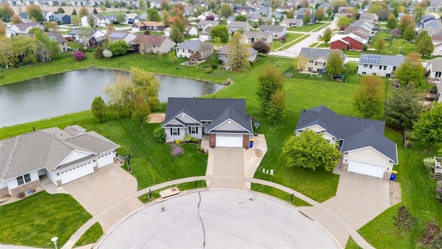 aerial view with a water view and a residential view