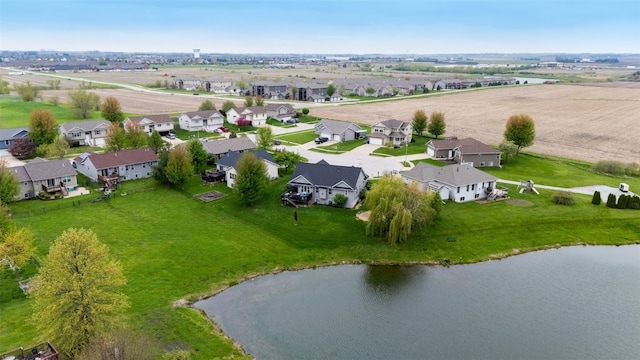 bird's eye view with a residential view and a water view