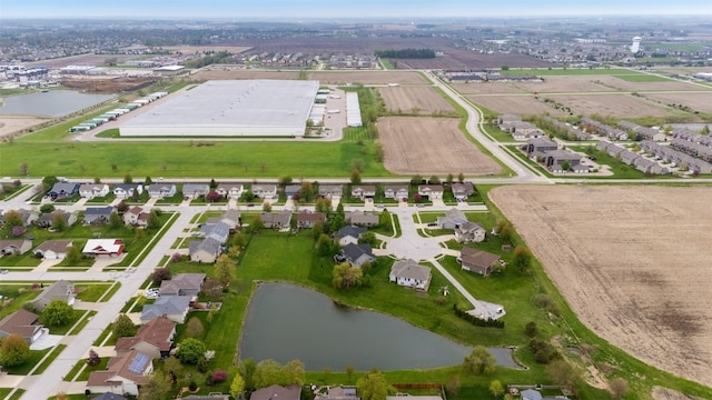 drone / aerial view with a residential view and a water view