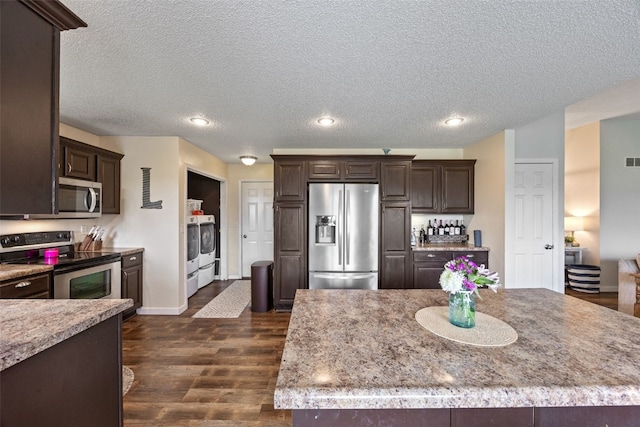 kitchen with dark brown cabinets, appliances with stainless steel finishes, a textured ceiling, recessed lighting, and dark wood-style floors