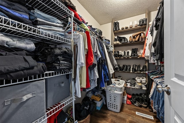spacious closet with visible vents and wood finished floors
