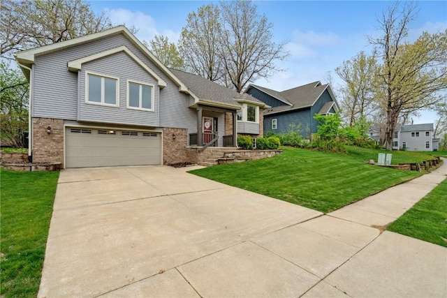 view of front of house featuring an attached garage, concrete driveway, a front lawn, and brick siding