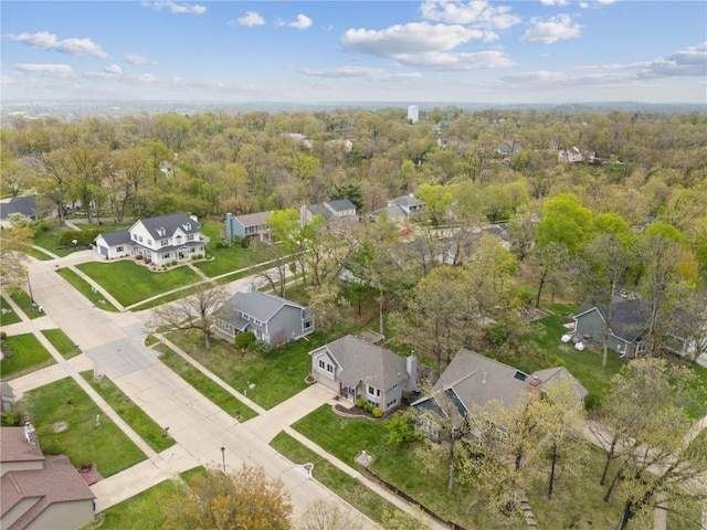 bird's eye view featuring a residential view and a forest view