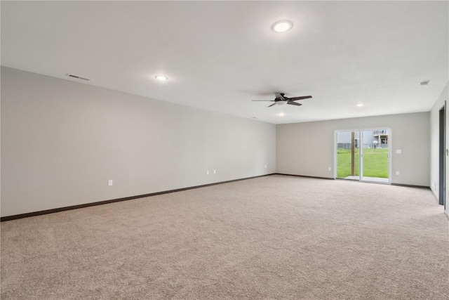empty room featuring recessed lighting, ceiling fan, visible vents, and light carpet
