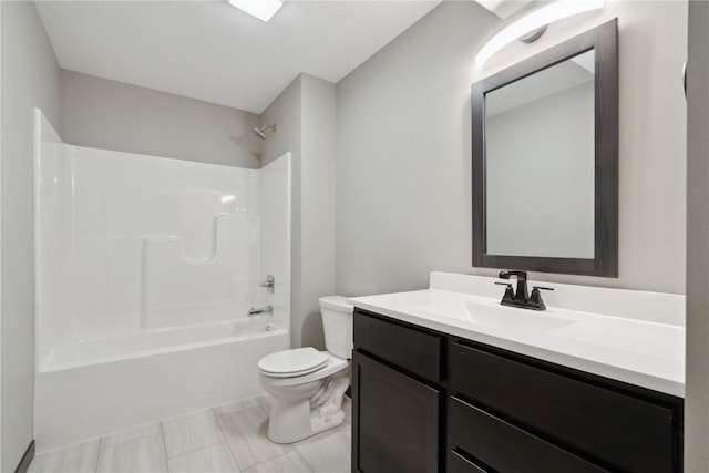 full bathroom featuring vanity, washtub / shower combination, and toilet