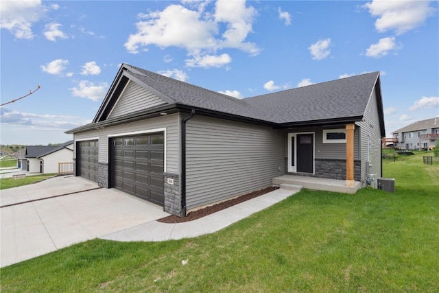 view of front of property featuring stone siding, a garage, a front yard, concrete driveway, and central air condition unit