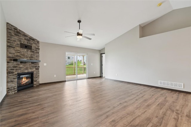 unfurnished living room featuring a large fireplace, a ceiling fan, baseboards, wood finished floors, and visible vents