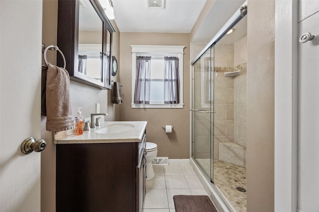 full bath featuring visible vents, vanity, tile patterned flooring, toilet, and a shower stall