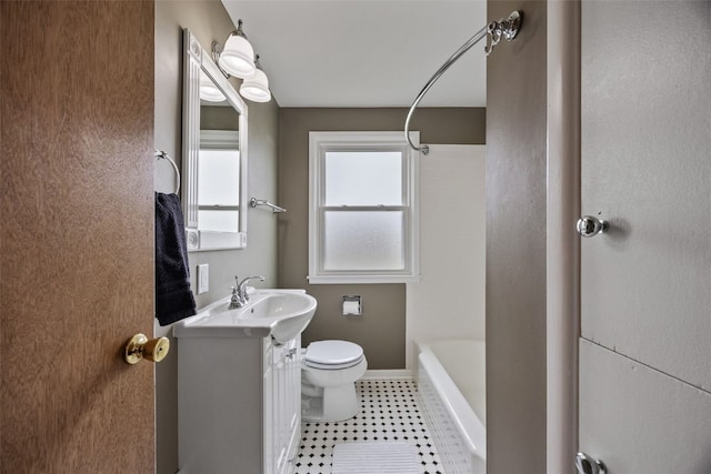 bathroom with toilet, shower / bathing tub combination, tile patterned flooring, and vanity