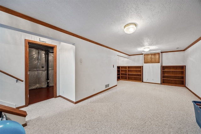 additional living space featuring visible vents, a textured ceiling, baseboards, and light carpet