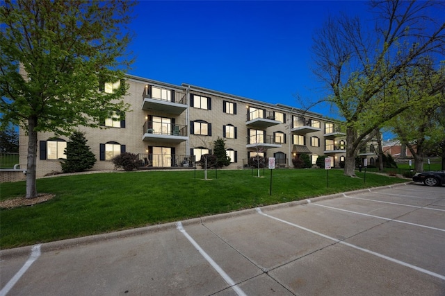 view of property featuring uncovered parking