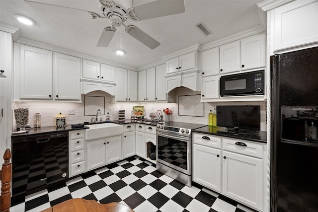 kitchen featuring dark countertops, tile patterned floors, a ceiling fan, visible vents, and black appliances