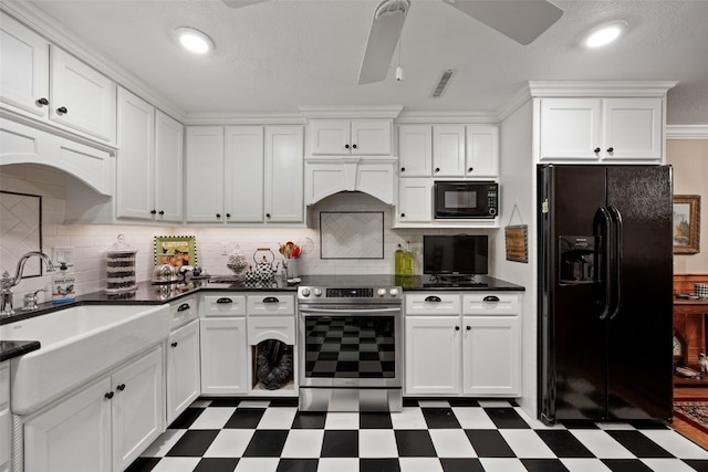 kitchen featuring white cabinetry, dark floors, a sink, and black appliances